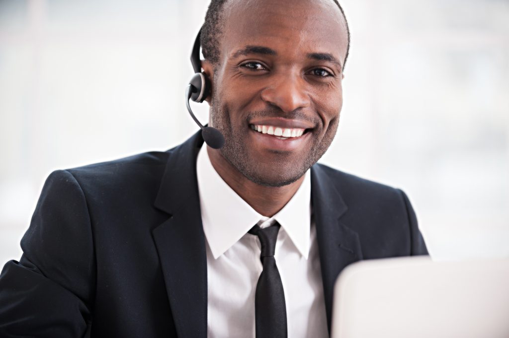 Man smiling talking on headset