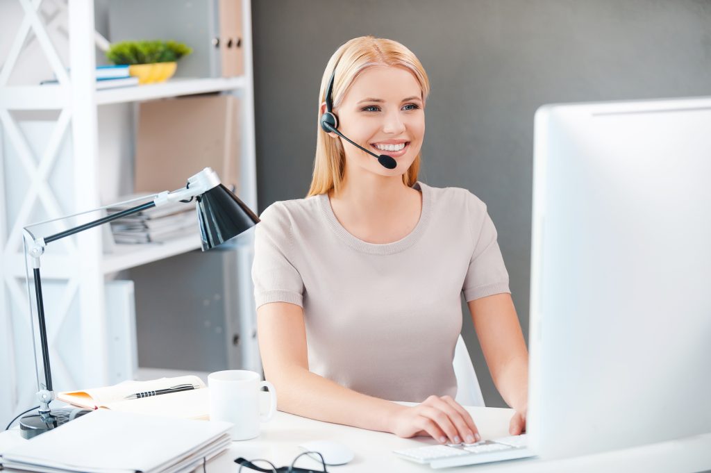 Young woman smiling with headset