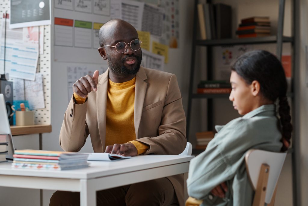 Boss talking with young employee