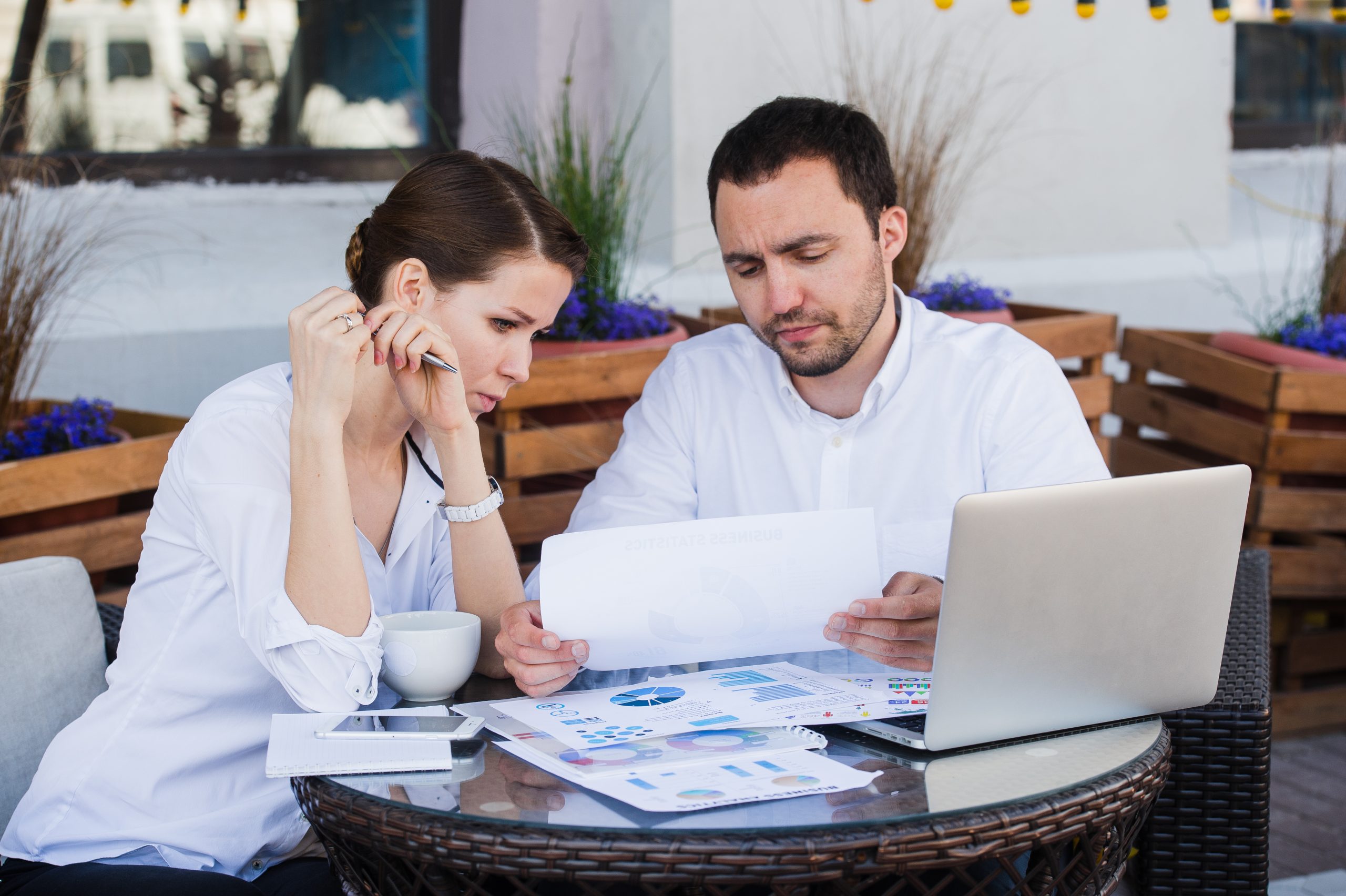 business people conflict working problem, angry boss argue scream to colleague businessmen and women serious argument negative emotion discussing report meeting at outdoors cafe during the lunch break two business people working out conflict