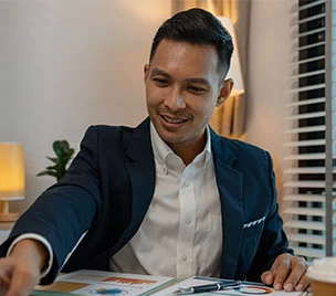 man reaching over table