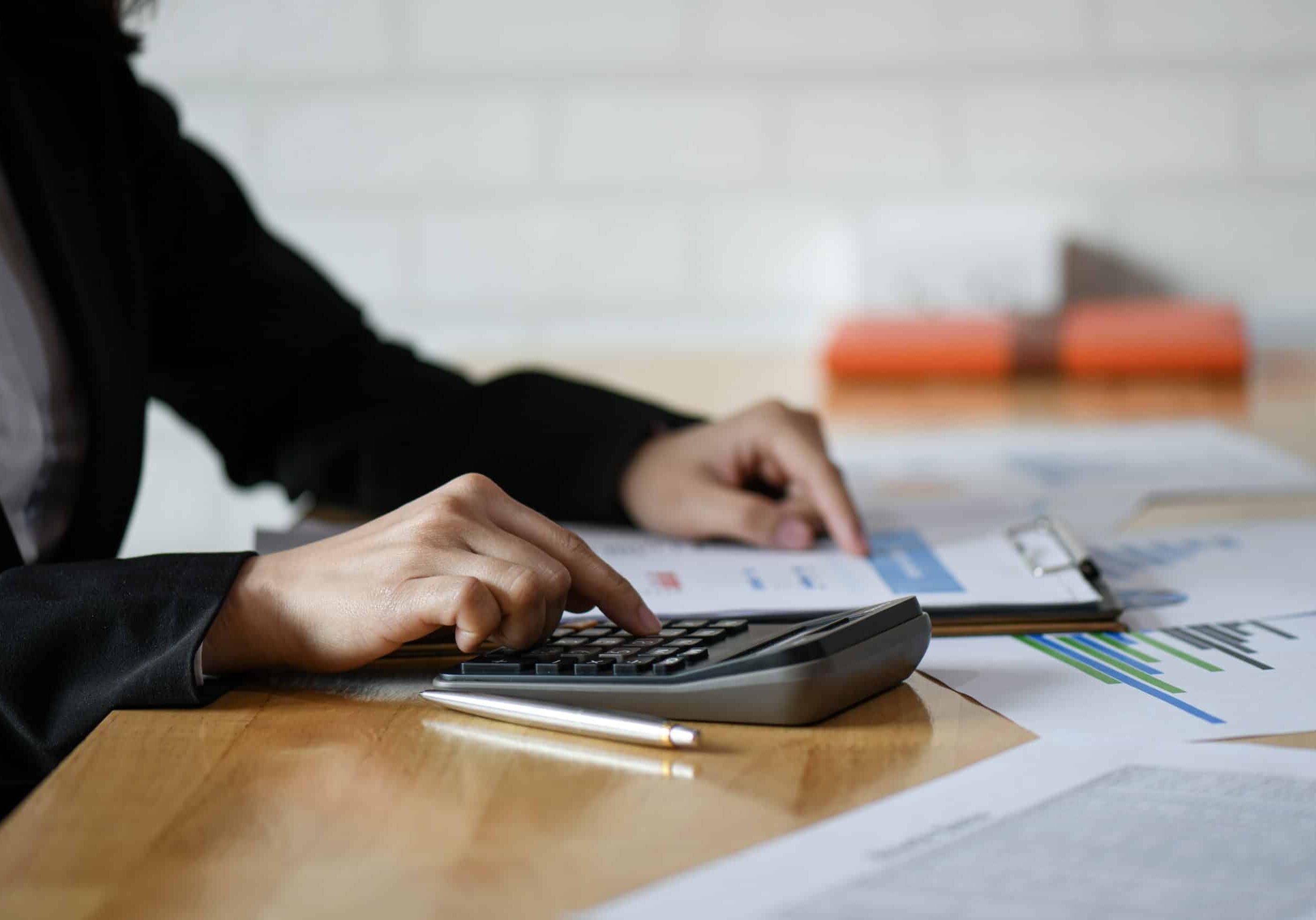 Accounting concept,Accounting staff is summarizing the company b calculator