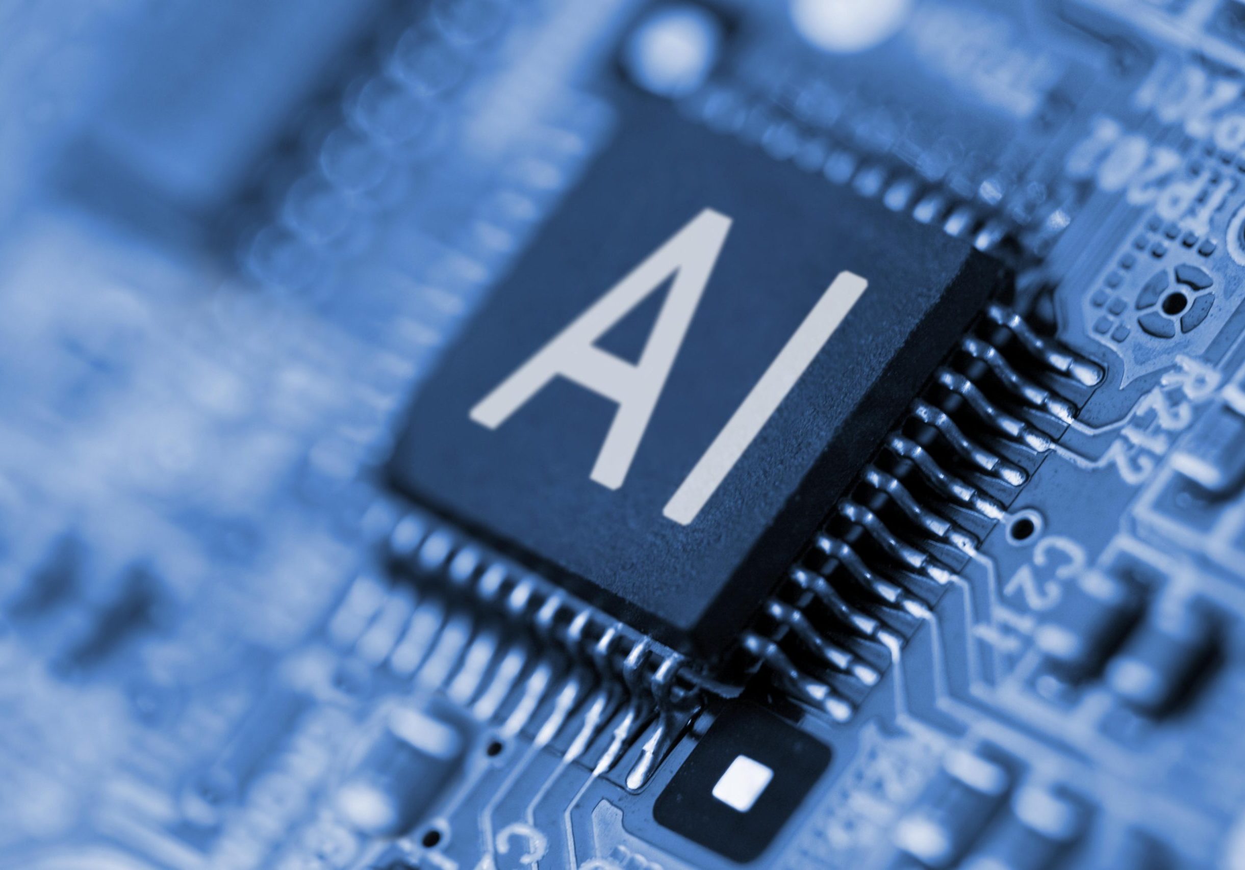 artificial intelligence (ai) and machine learning (ml) AI computer chip in front of motherboard