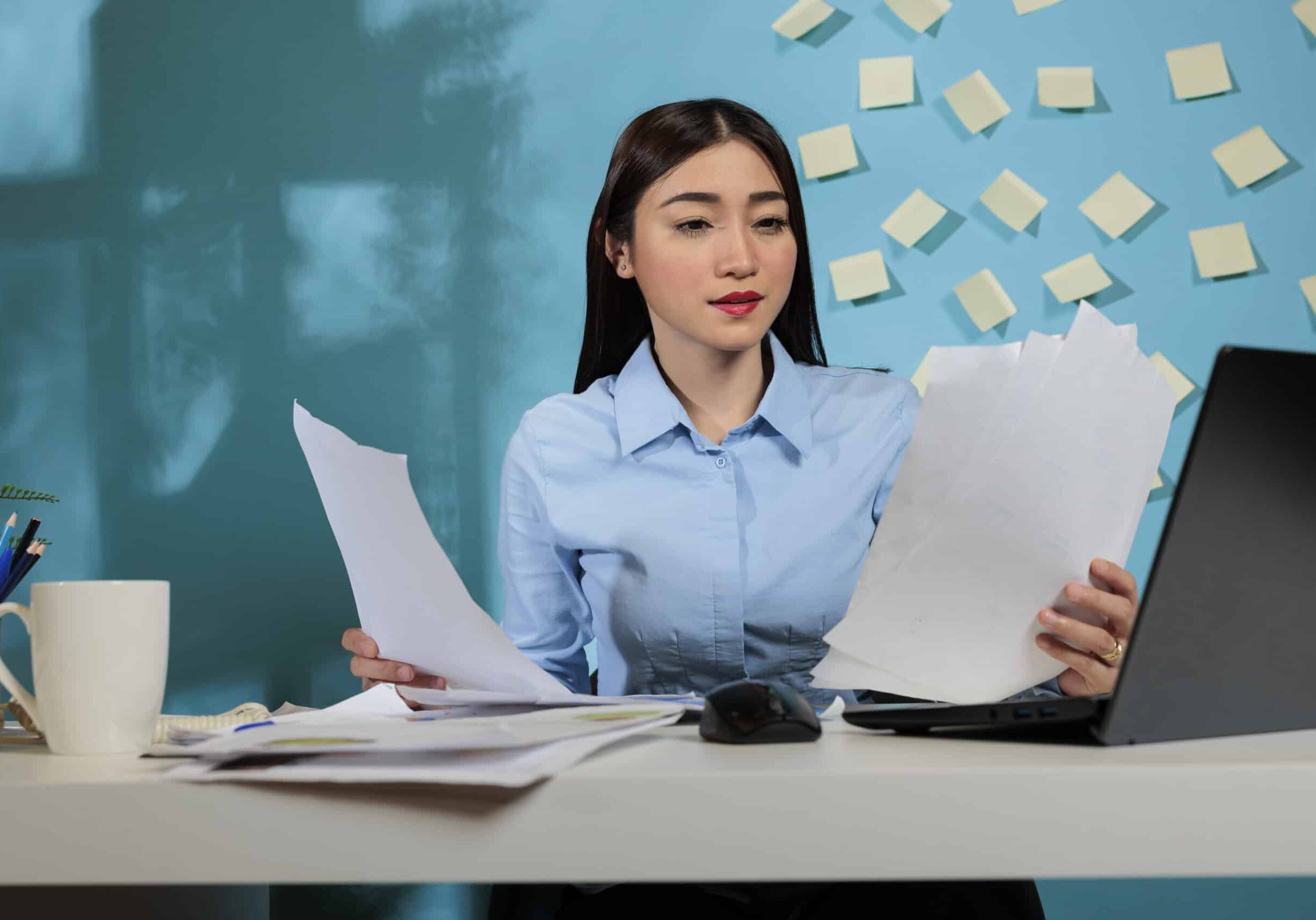 Female secretary doing paperwork at office female secretary doing-paperwork at office